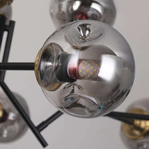 black-iron-chandelier-with-globe-glass-shades-7