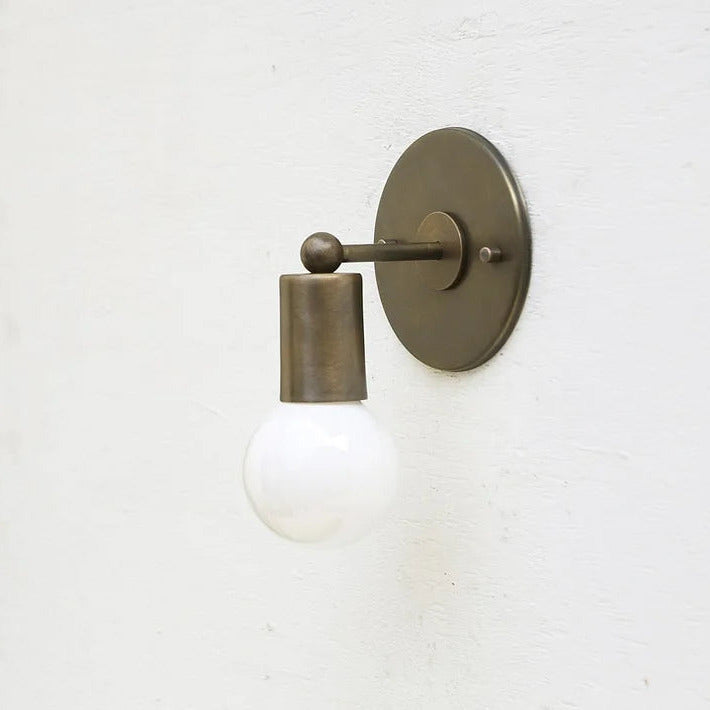 brass-cylinder-wall-sconce-with-minimal-arm-1