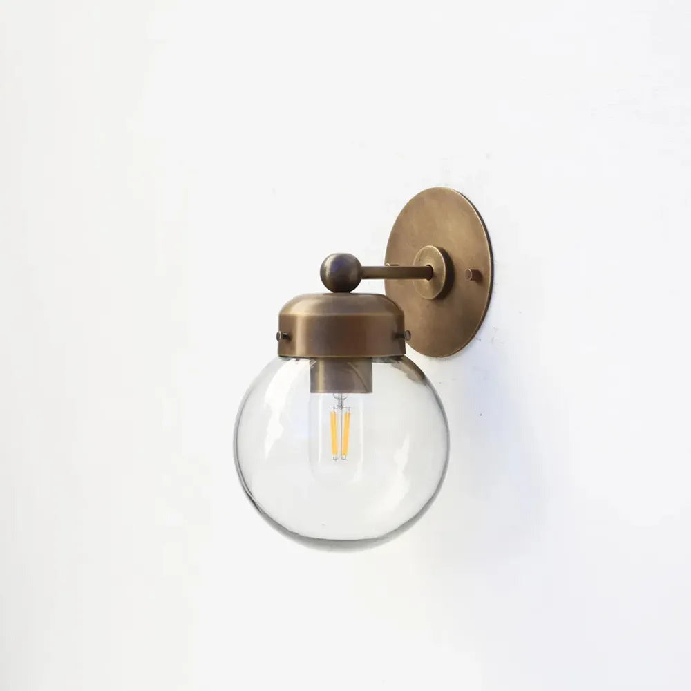 brass-wall-lamp-with-hand-blown-clear-glass-globe-01