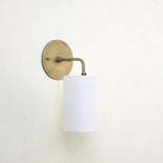 Curved Arm Brass Wall Sconce with Linen Drum Shade