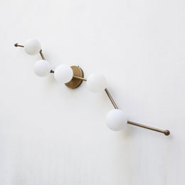 Five-Light Staggered Brass Bar Sconce with Opal Glass Globes