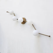 Five-Light Staggered Brass Bar Sconce with Opal Glass Globes