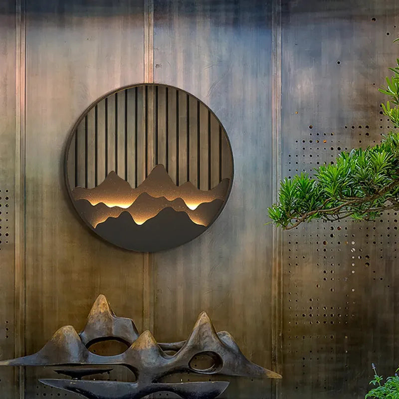 layered-circle-wall-sconce-with-engraved-mountain-motif-1