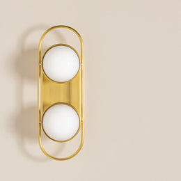 Lyra Aged Brass Globe Vanity Sconce