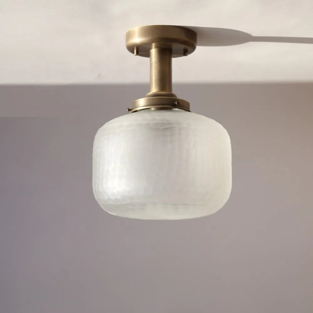 minimalist-brass-ceiling-light-with-spherical-glass-shade-01