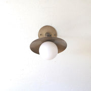 One-Light Adjustable Brass Saucer Wall Sconce with Opal Globe