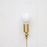 One-Light Adjustable Plug-In Wall Sconce with Exposed Bulb