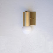 One-Light Brass Cylinder Wall Sconce with Opal Globe