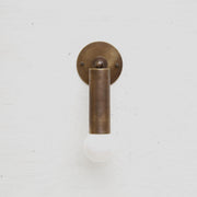 One-Light Brass Sleeve Wall Sconce with Exposed Bulb