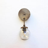 One-Light Brass Wall Sconce with Smoked Glass Globe