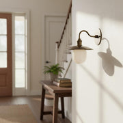 One-Light Industrial Wall Sconce with Brass Shade and Milk Glass Diffuser