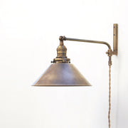 One-Light Plug-In Swing Arm Wall Sconce with Brass Cone Shade