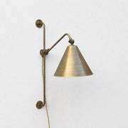 One-Light Plug-In Swing Arm Wall Sconce with Brass Cone Shade