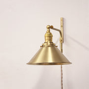 One-Light Plug-In Swing Arm Wall Sconce with Brass Cone Shade