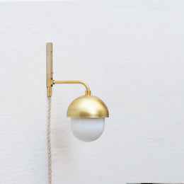 One-Light Plug-In Wall Sconce with Brass Cap and Opal Globe