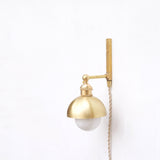 One-Light Plug-In Wall Sconce with Brass Dome Shade