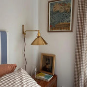 Plug-In Swing Arm Wall Sconce with Brass Cone Shade