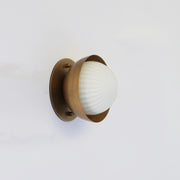 Ribbed Opal Globe Wall Sconce with Brass Half Shade