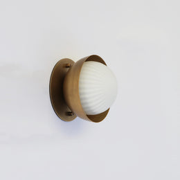 Ribbed Opal Globe Wall Sconce with Brass Half Shade