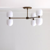 Six-Light Brass Chandelier with Opal Capsule Shades