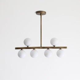 Six-Light Brass Linear Chandelier with Ribbed Opal Globes