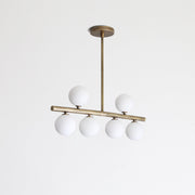 Six-Light Brass Linear Chandelier with Ribbed Opal Globes