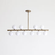 Ten-Light Brass Linear Chandelier with Ribbed Opal Globes