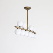Ten-Light Brass Linear Chandelier with Ribbed Opal Globes