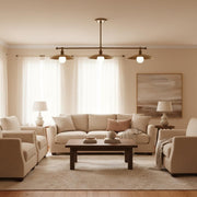 Three-Light Linear Brass Chandelier with 12-Inch Disc Shades