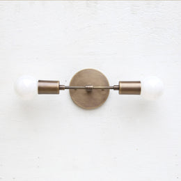 Two-Light Brass Wall Sconce with Exposed Bulbs