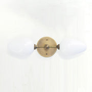 Two-Light Brass Wall Sconce with Opal Tulip Shades