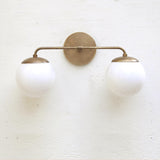 Two-Light Opal Globe Bathroom Vanity Wall Sconce